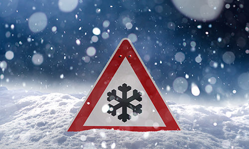 winter driving – risk of snow and ice – traffic sign