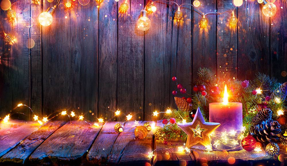 Advent – Candle Glowing In Christmas Lights On Wooden Table With